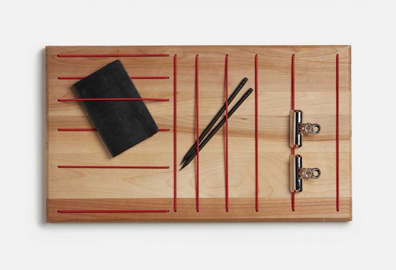 wood wall organizer with red elastic holders