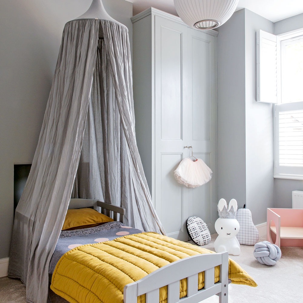 grey kids room with fabric bed canopy